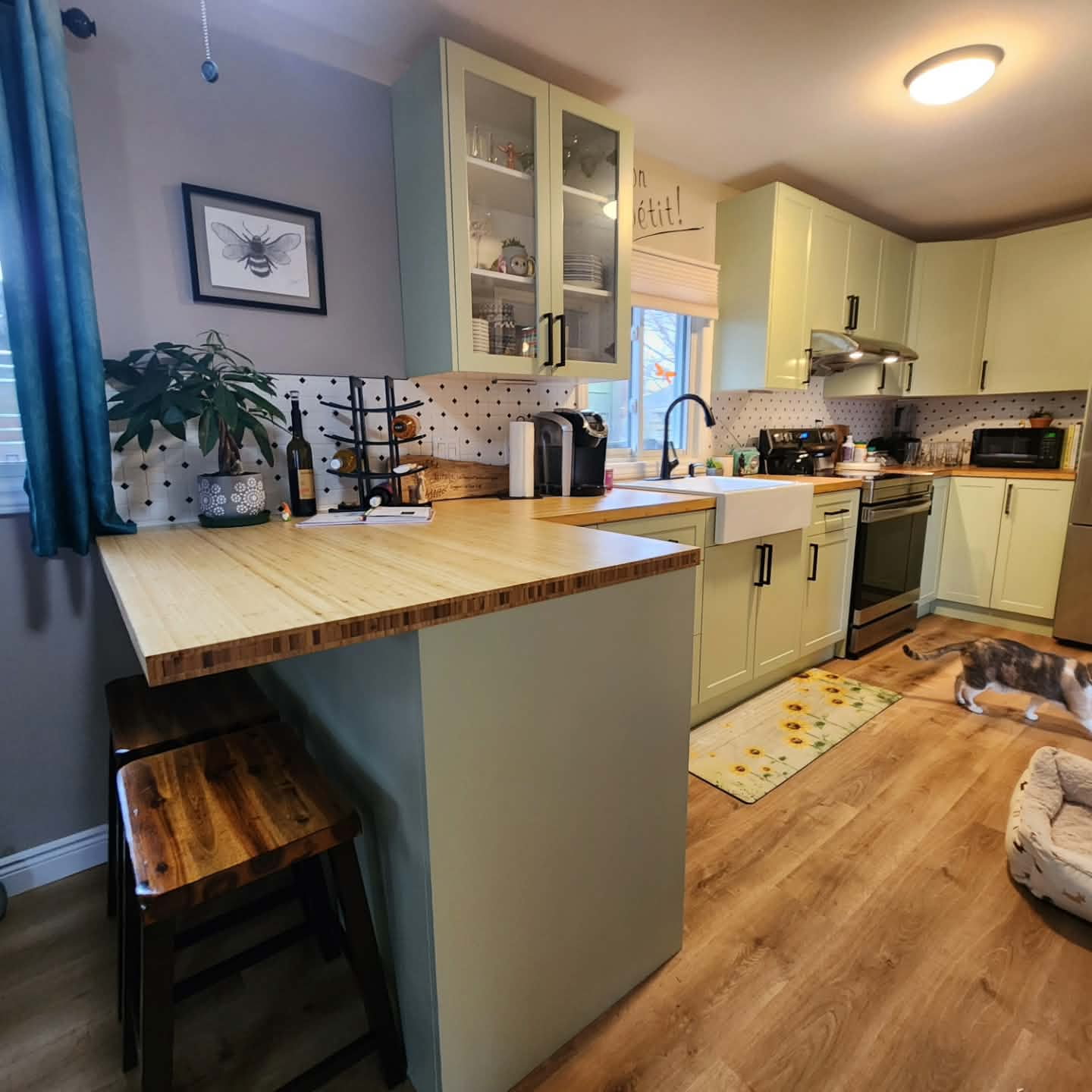 Sage Green Kitchen with Butcher Block Counters and Farmhouse Sink - After
